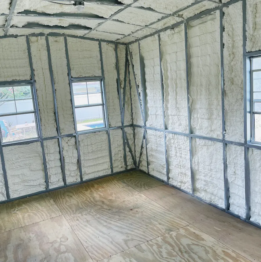 Closed-cell spray foam insulation applied to wall cavities in a residential project in West Athens